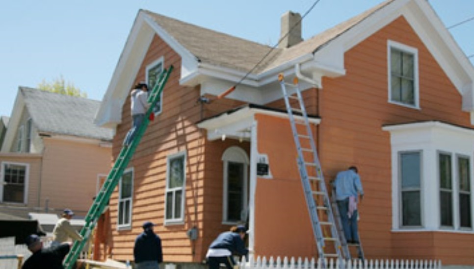 people repairing a house